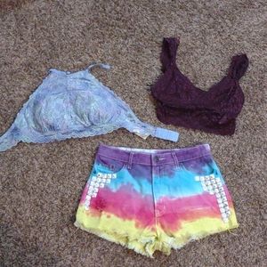 2 bralettes and a pair of tie dye shorts.